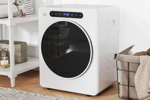 Un sèche-linge blanc compact avec hublot rond. Apprenez comment utiliser un sèche-linge pour un linge toujours sec et doux.